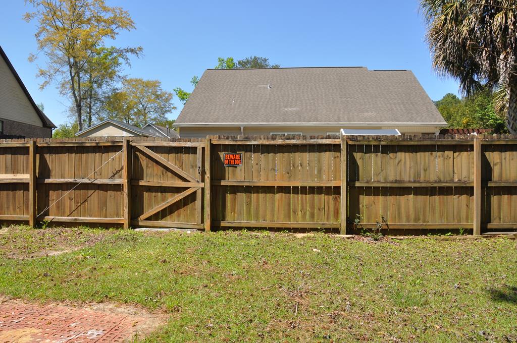 The back side of the smaller privacy fenced area.